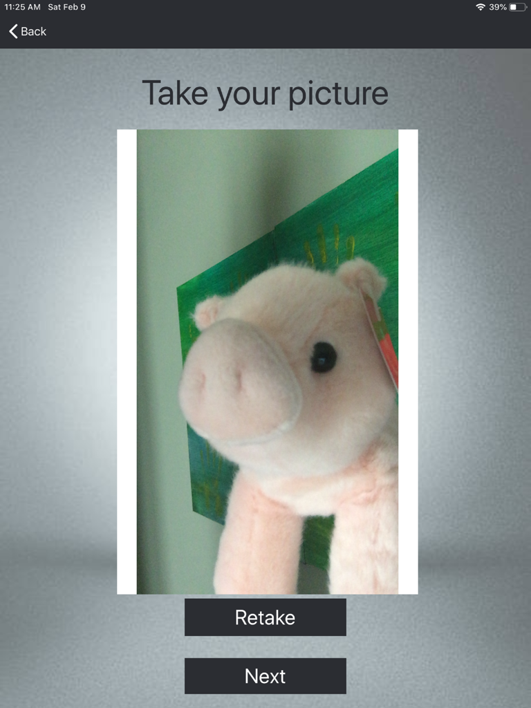 iPad screen of a visitor management app showing the take your picture step with a preview and navigation buttons