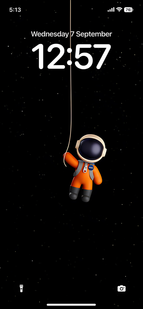 4K Wallpaper - HD Wallpaper - A 3D cartoon astronaut in an orange suit floating in space on an iPhone lock screen.