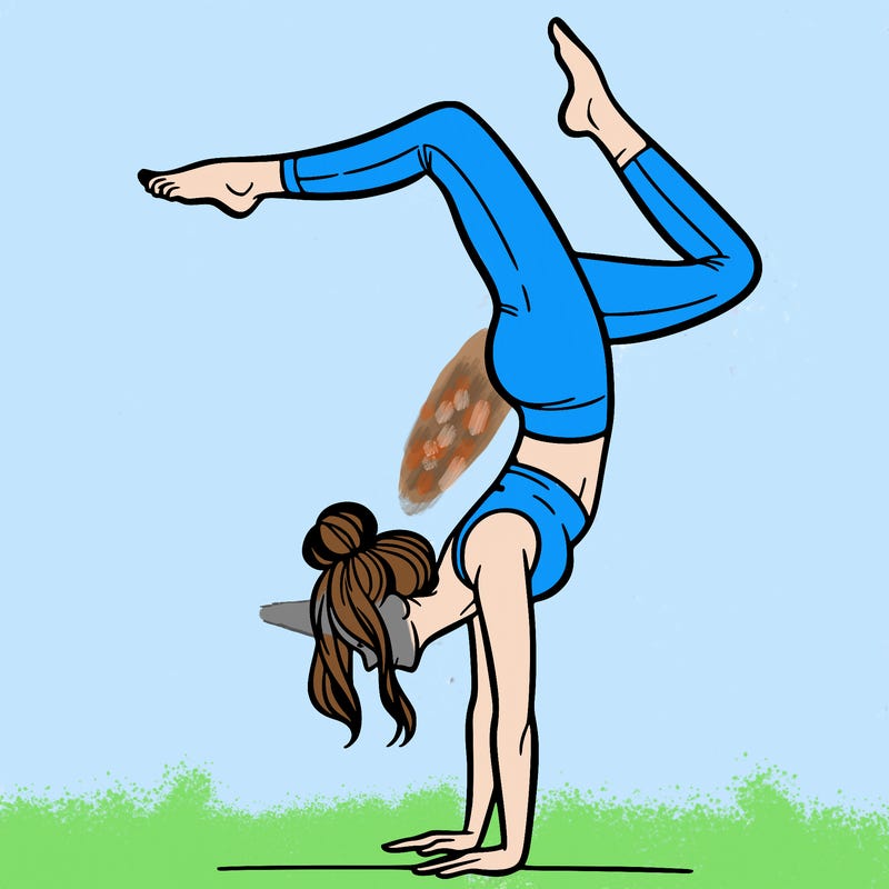 a woman doing a handstand