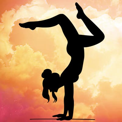 a woman doing a handstand