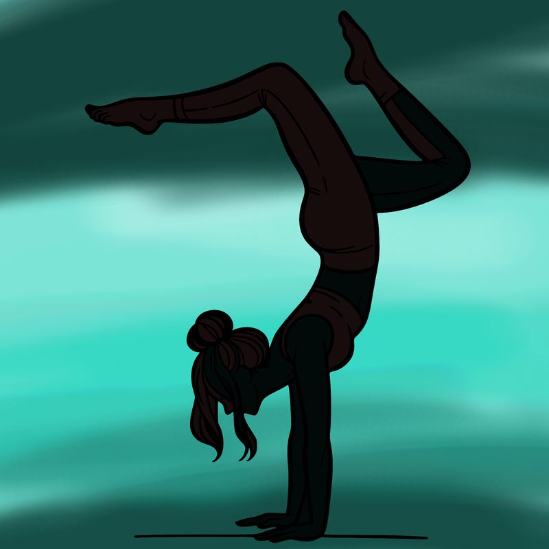 a woman doing a handstand