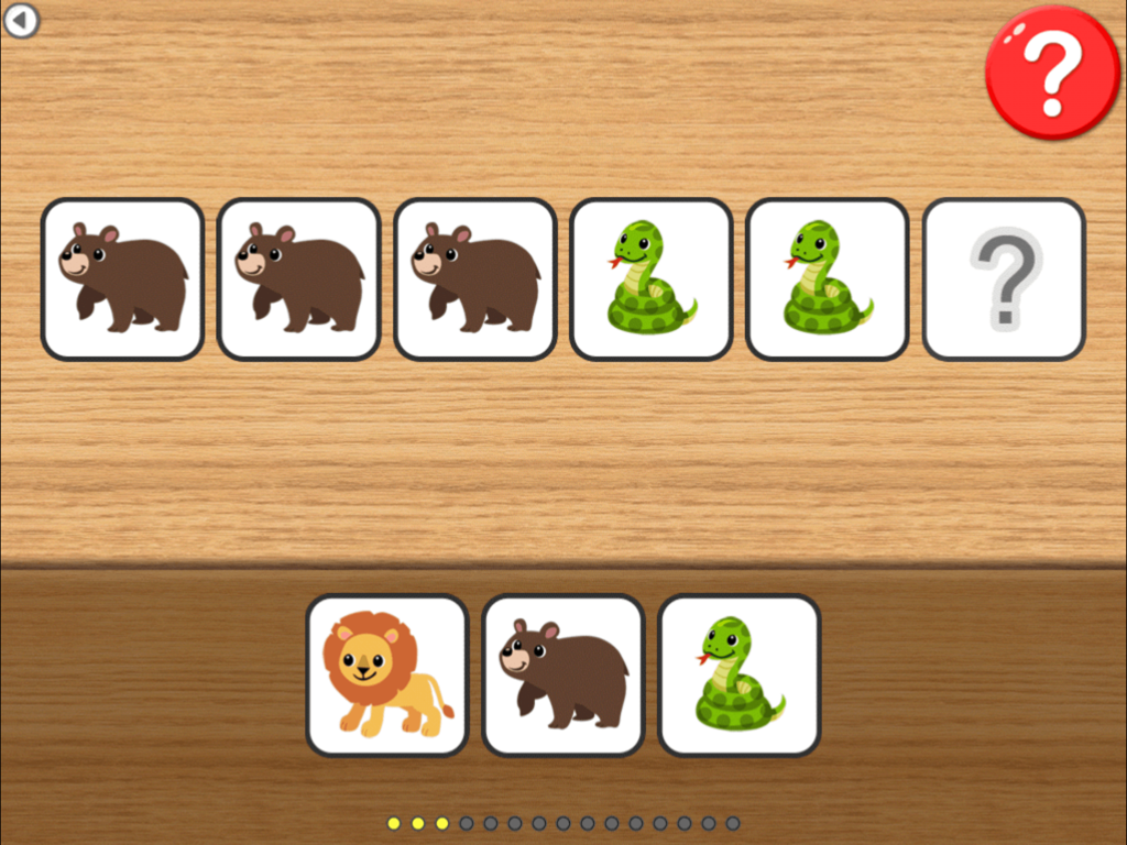 A pattern recognition activity in the Injini app with bear and snake cards on a wooden background.