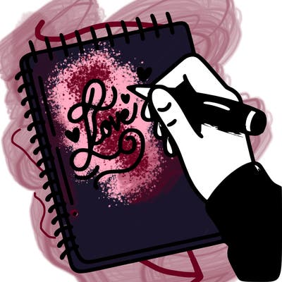 a hand writing “love” in calligraphy on a notebook
