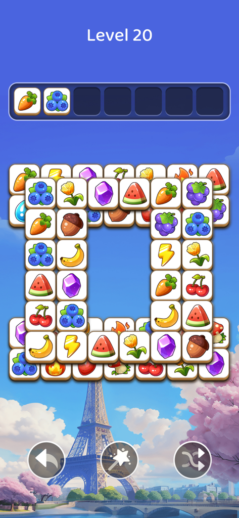 Nível 20 de quebra-cabeça de combinação de peças no Tile Explorer com fundo da Torre Eiffel