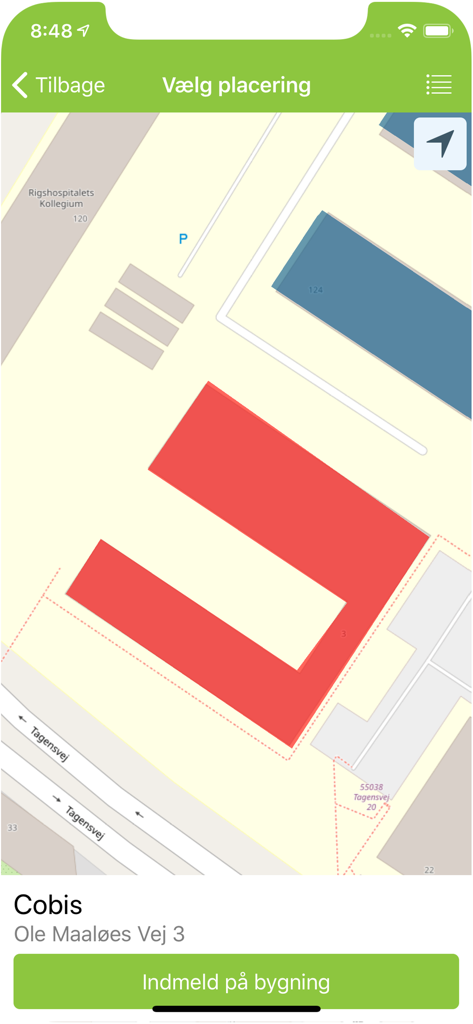 A mobile interface of the DaluxFM HelpDesk app displaying a map view with a building highlighted in red for maintenance reporting