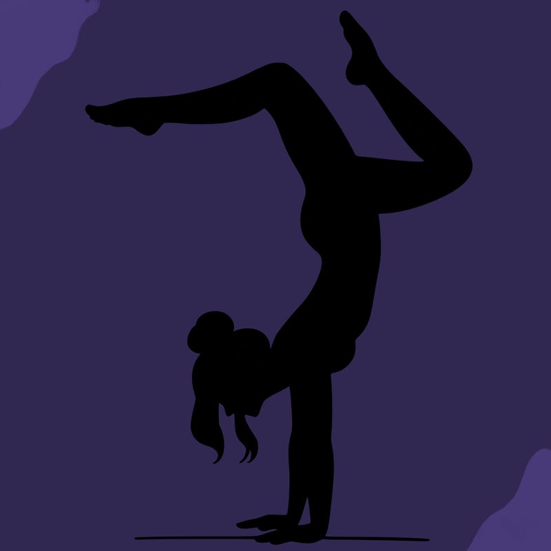 a woman doing a handstand