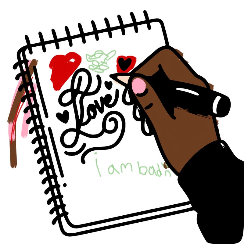 a hand writing “love” in calligraphy on a notebook