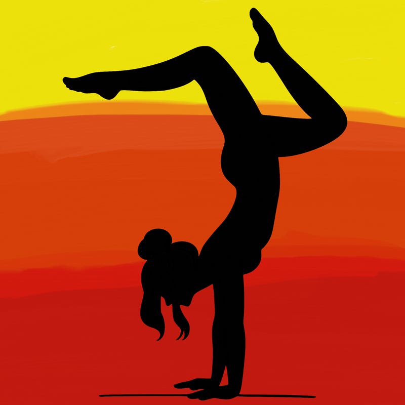 a woman doing a handstand