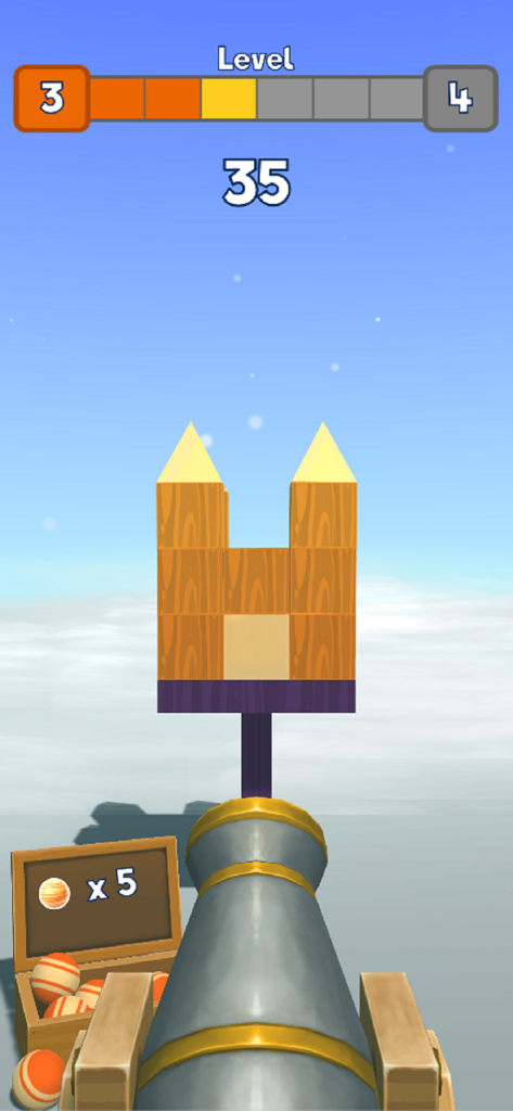 모바일 게임 Knock Balls에서 나무 구조물을 조준하고 있는 대포