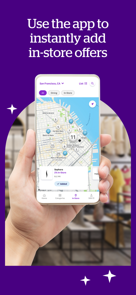 A hand holding a smartphone displaying the Rakuten app map view with nearby in-store cash back offers and a Sephora deal selected.