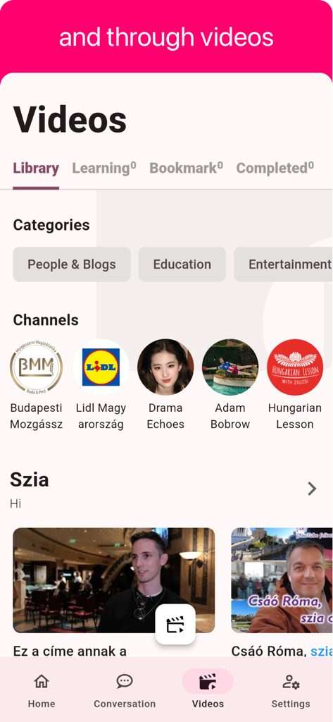 Una captura de pantalla de la aplicación de aprendizaje de idiomas húngaro que muestra una biblioteca de videos con categorías como educación y entretenimiento, junto con varios canales de idiomas húngaros.