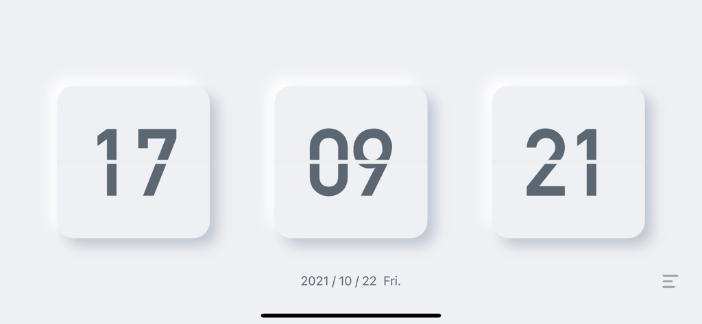 Minimalist white flip clock interface on a light gray background showing time and date in landscape mode