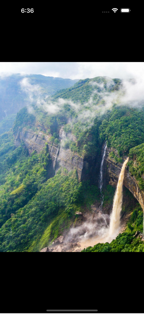 ASIAN Geographic Magazine - Stunning nature photography of a waterfall in a lush mountain landscape from Asian Geographic Magazine