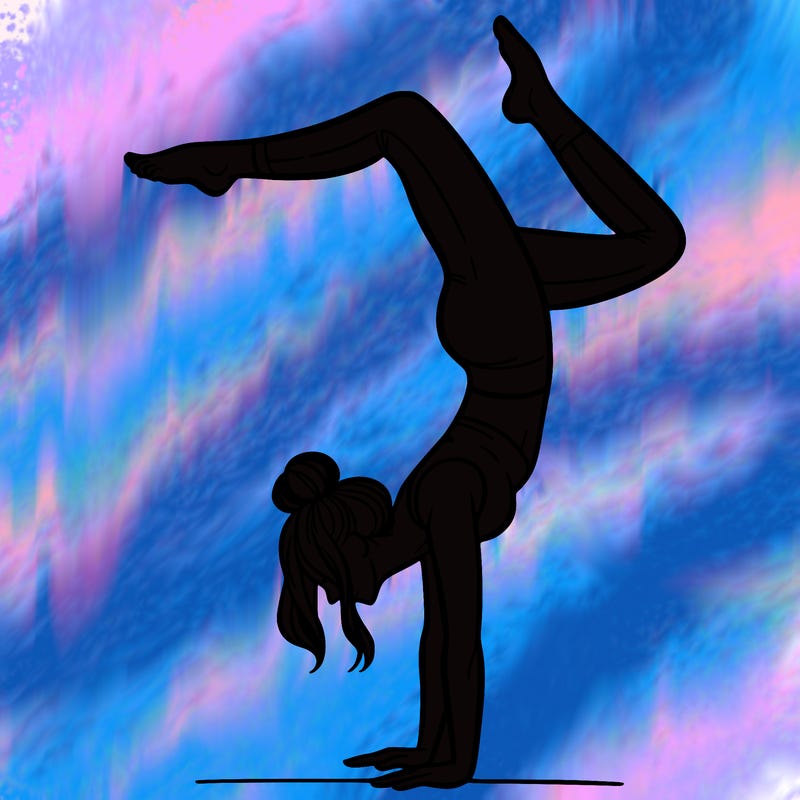 a woman doing a handstand