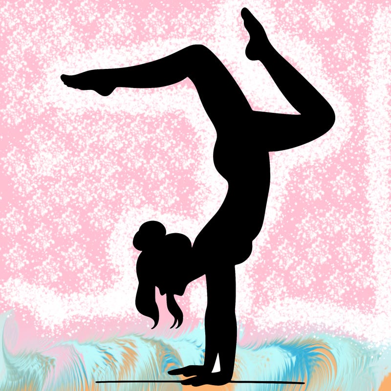 a woman doing a handstand