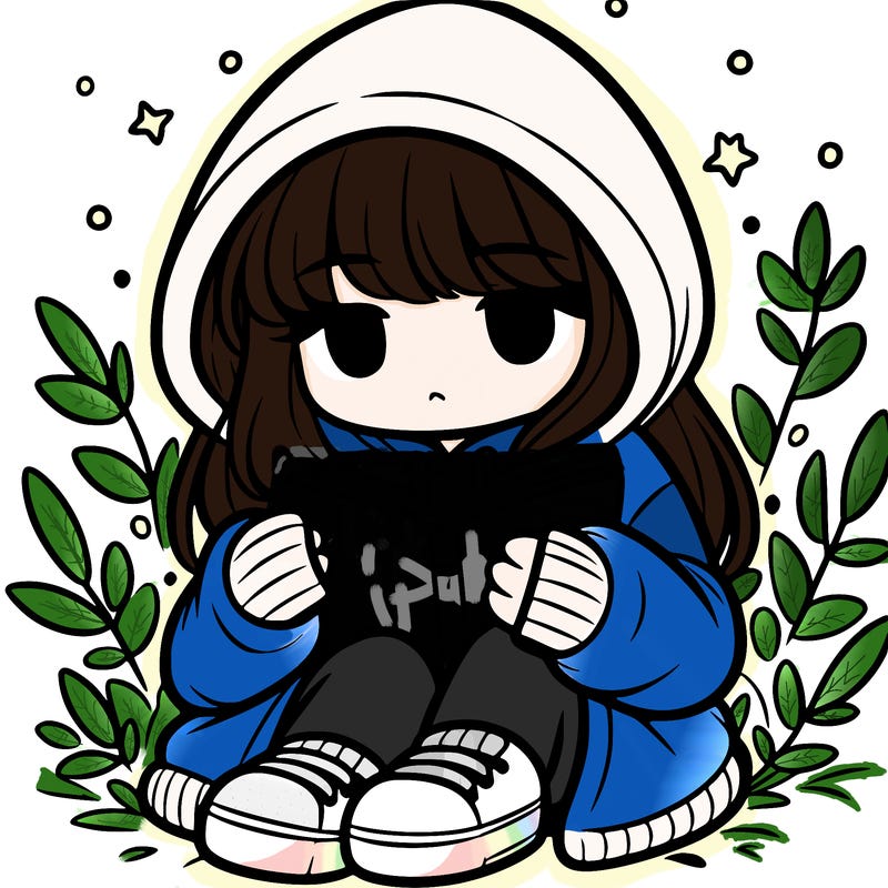 girl in oversized hoodie reading a book