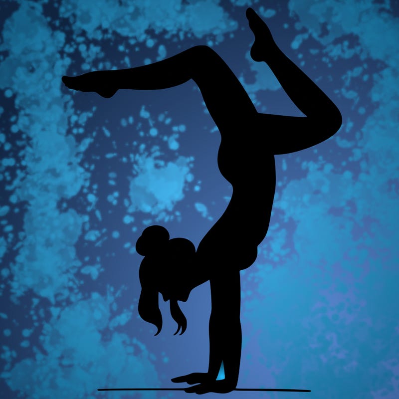 a woman doing a handstand
