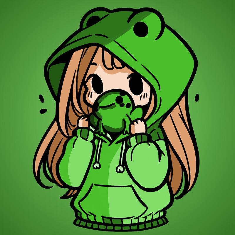 a girl holding a froggy hoodie