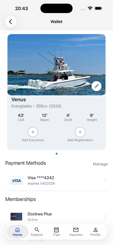The Dockwa app wallet screen showing boat specifications for the vessel Venus, saved payment methods, and Dockwa Plus membership status.