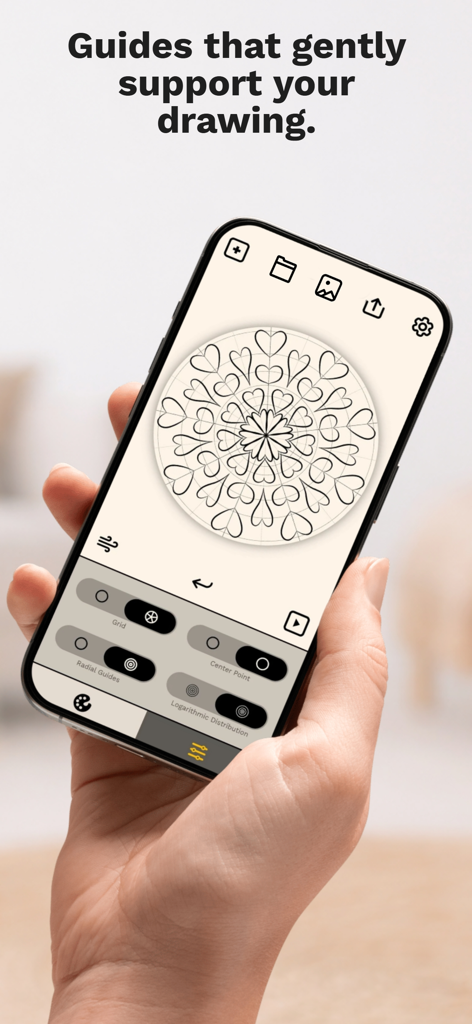 Make it Mandala app interface showing symmetry drawing guides and a heart patterned mandala design.