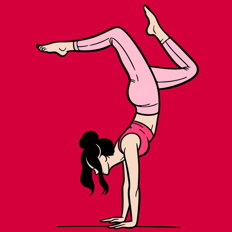 a woman doing a handstand