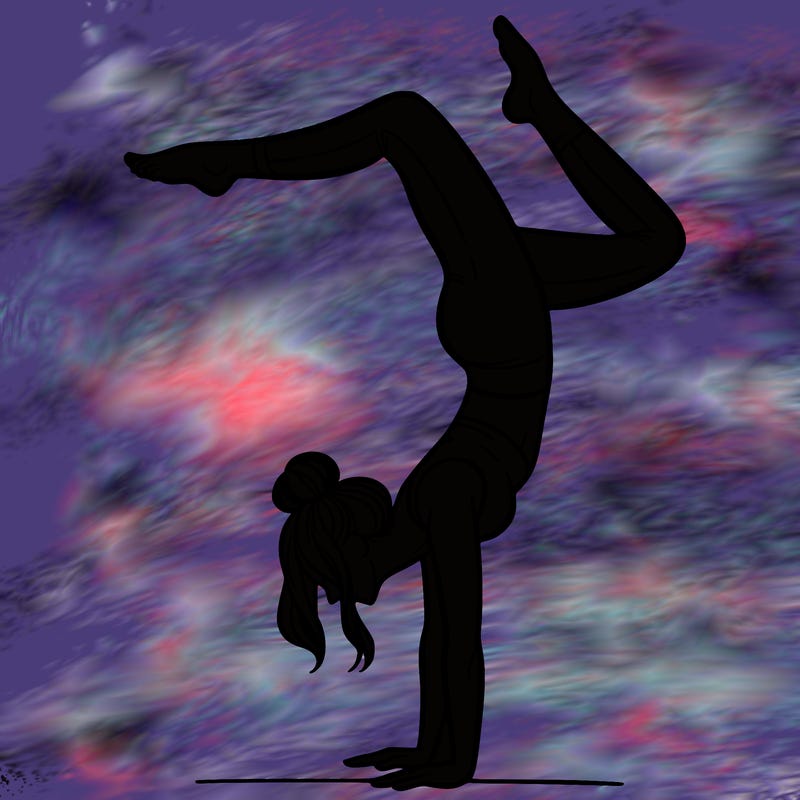 a woman doing a handstand