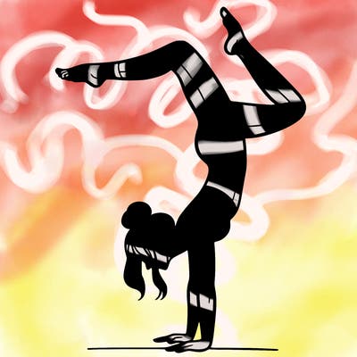 a woman doing a handstand
