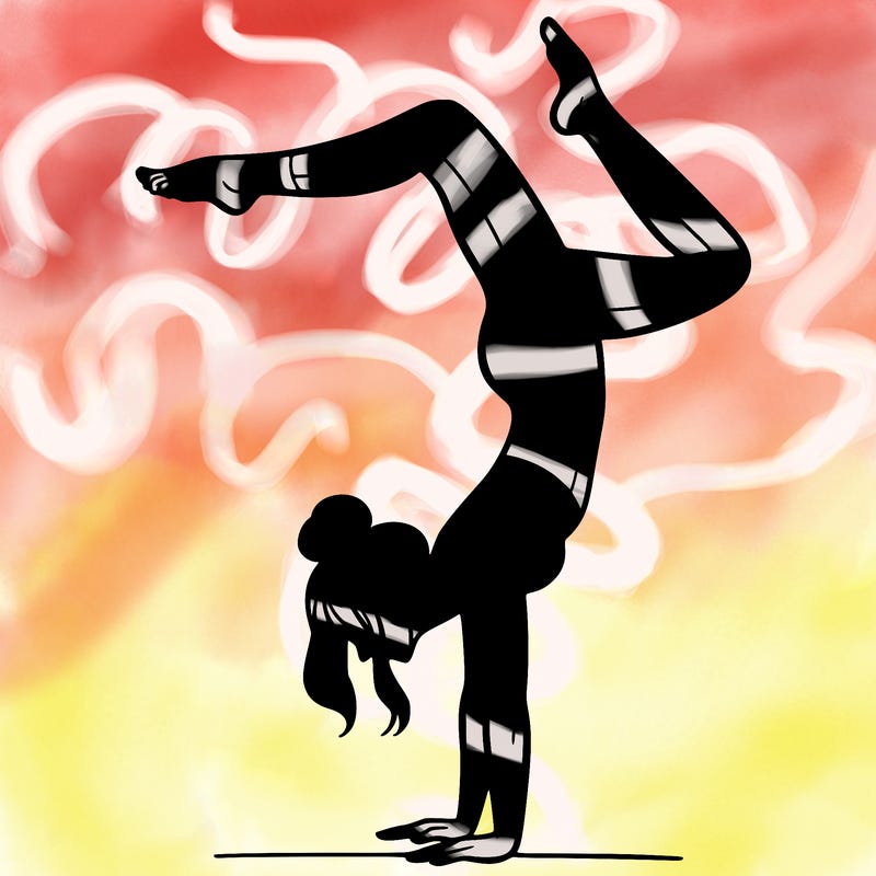 a woman doing a handstand