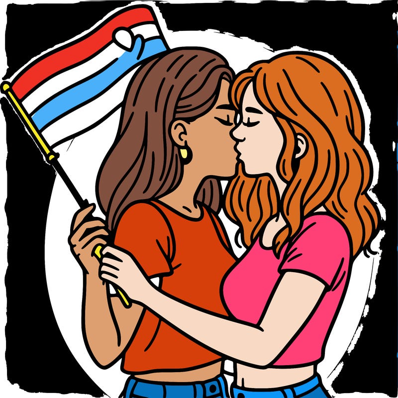 two women kissing while holding an lgbt flag