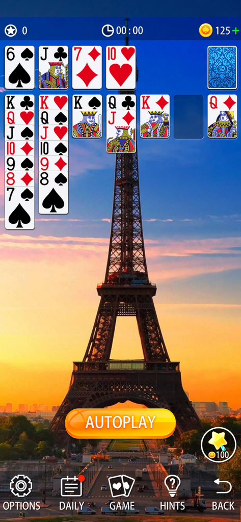 Classic solitaire gameplay with a scenic Eiffel Tower background at sunset