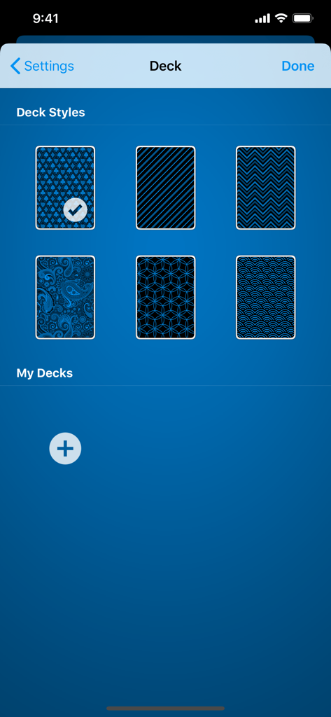Tela de personalização de baralho no aplicativo King's Corner mostrando vários padrões de verso de carta azuis