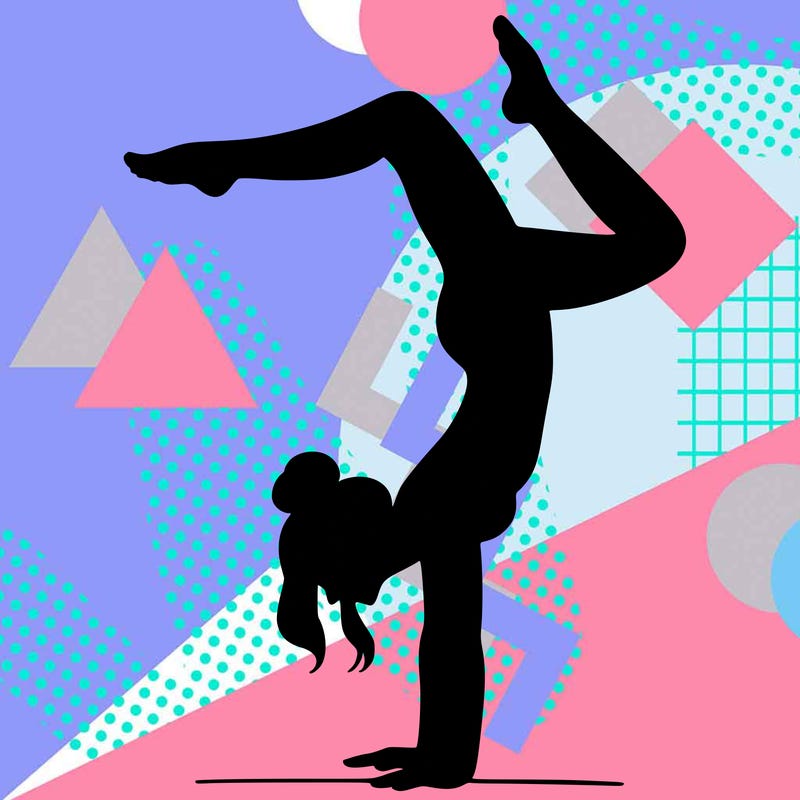 a woman doing a handstand