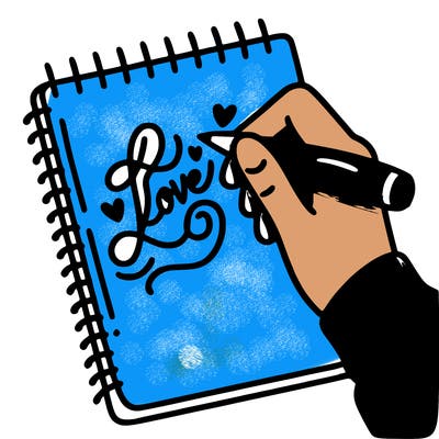 a hand writing “love” in calligraphy on a notebook