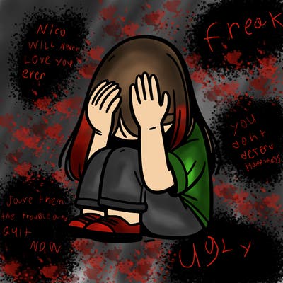 girl sitting down covering her head