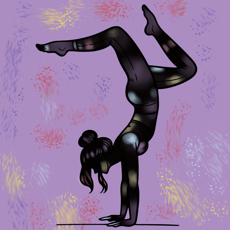 a woman doing a handstand