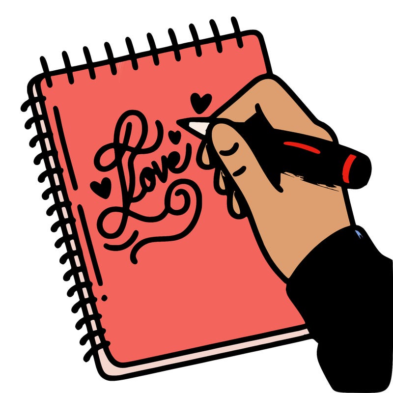 a hand writing “love” in calligraphy on a notebook