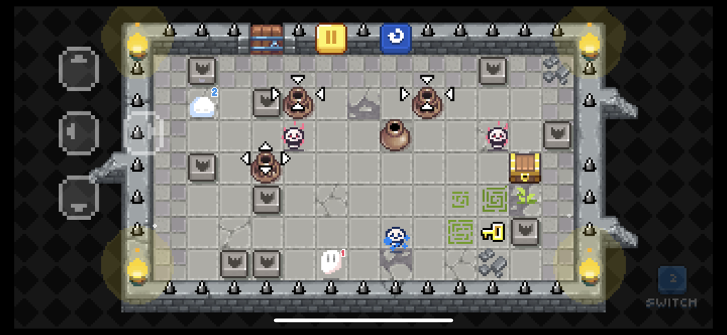 Ghost'n Brothers - A top down view of two pixel art ghosts in a dungeon puzzle level with spikes and treasure