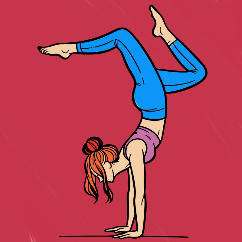 a woman doing a handstand
