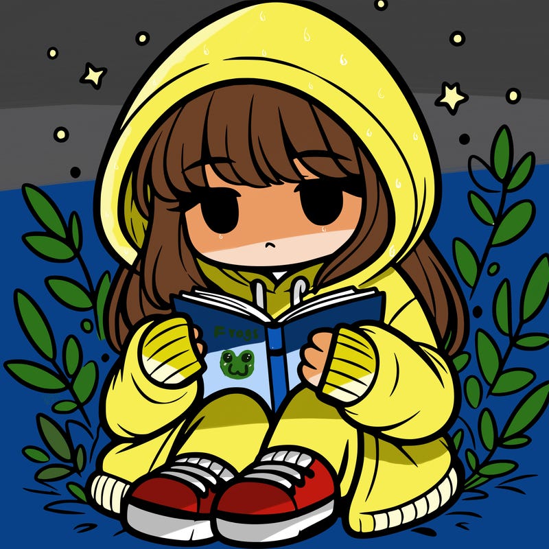 girl in oversized hoodie reading a book