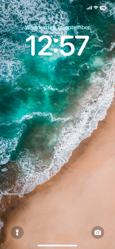 4K Wallpaper - HD Wallpaper - Aesthetic aerial view of ocean waves on an iPhone lock screen.