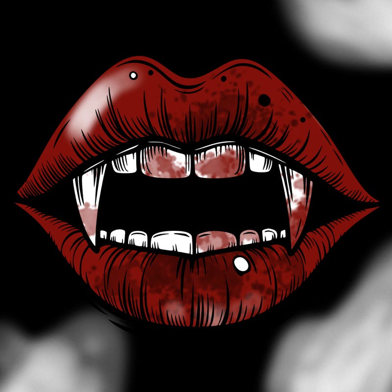 lips with vampire teeth
