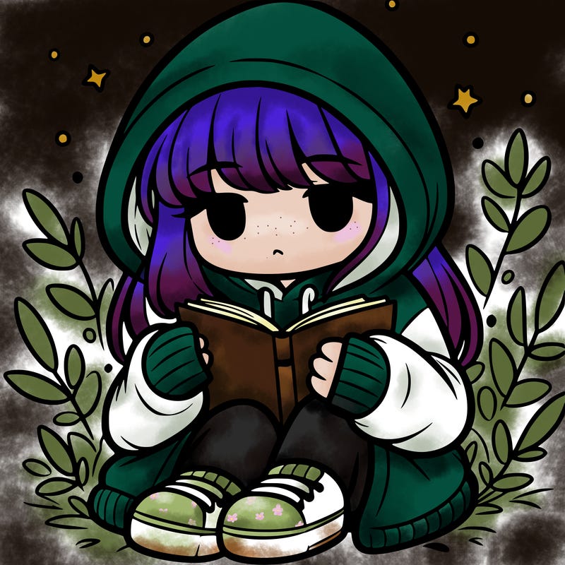 girl in oversized hoodie reading a book