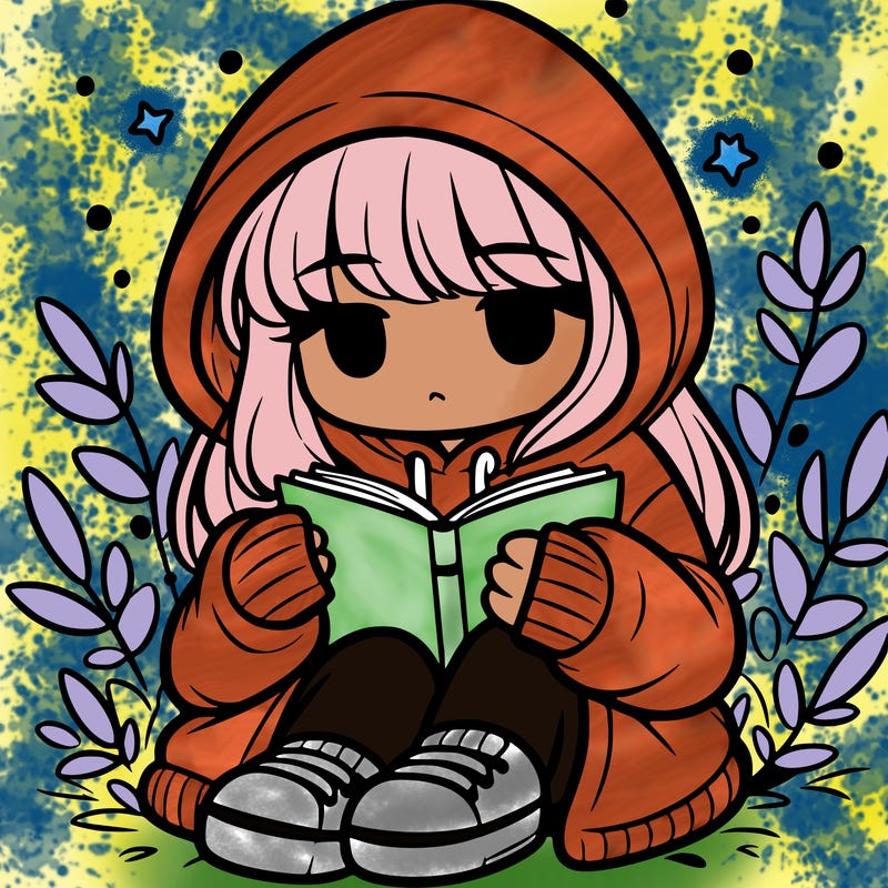 girl in oversized hoodie reading a book