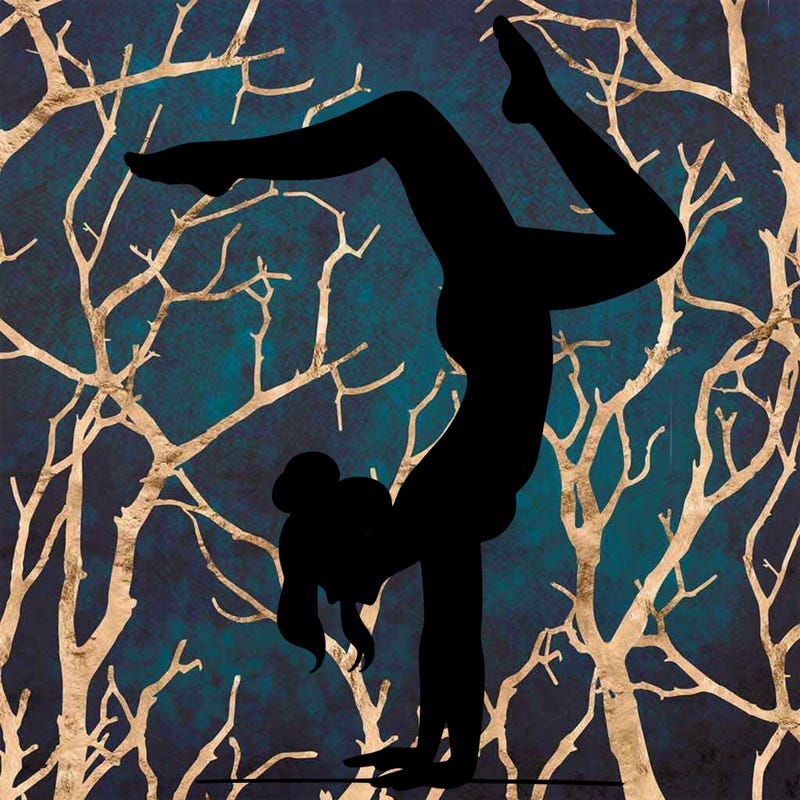 a woman doing a handstand