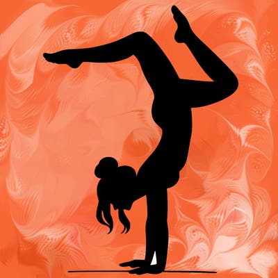 a woman doing a handstand