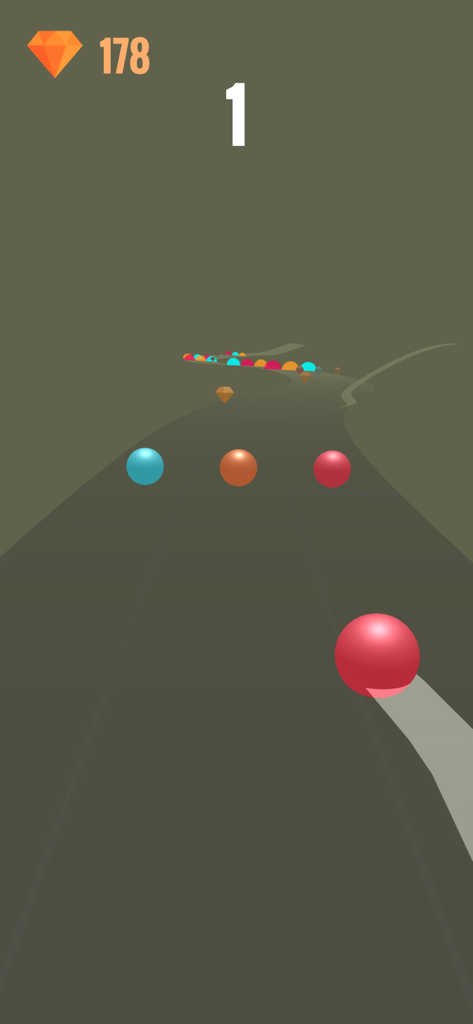 Color Ball Rush! - Uma bola vermelha rolando por um caminho 3D em direção a obstáculos e diamantes no jogo mobile Color Ball Rush