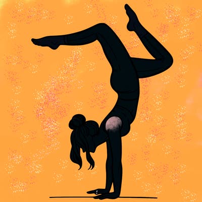 a woman doing a handstand
