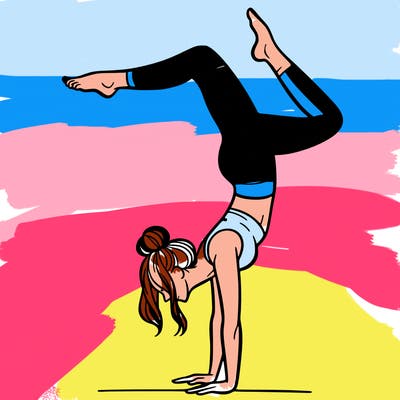 a woman doing a handstand