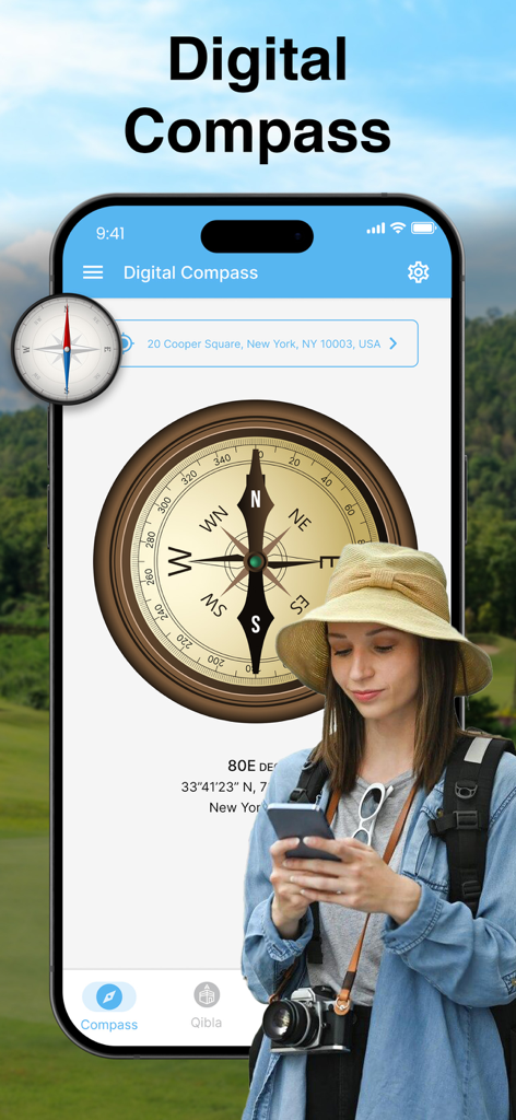 Compass App - Qibla finder - 屋外の旅行者が使用している携帯電話上のデジタルコンパスインターフェース。