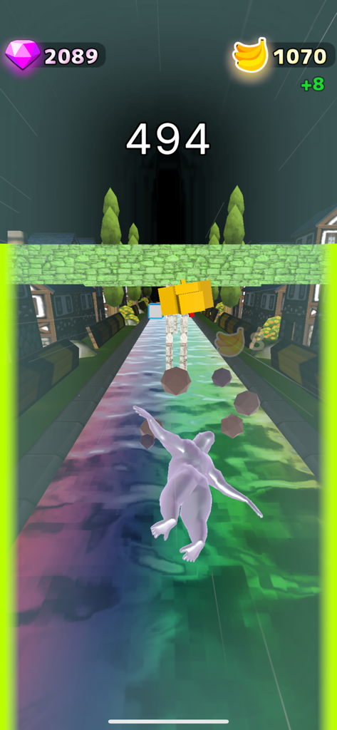 Flying Gorilla - A silver gorilla character flying through a 3D obstacle course on a rainbow colored track